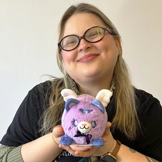 Squishable Alter Egos Series 18 Magical Kitty 4.5-Inch Plush, a lavender cat soft toy with wings and a purple bow