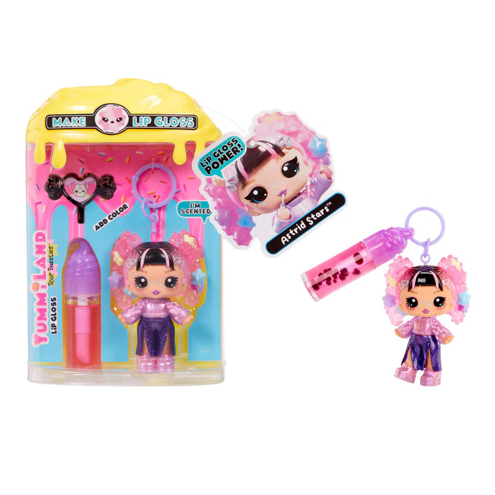 Yummiland Sour Sweeties Astrid Stars doll with pink hair in buns decorated with stars, wearing a sparkly purple outfit, shown with DIY lava lamp lip gloss kit components including pink lip gloss tube, scented drop packet, and keychain ring.