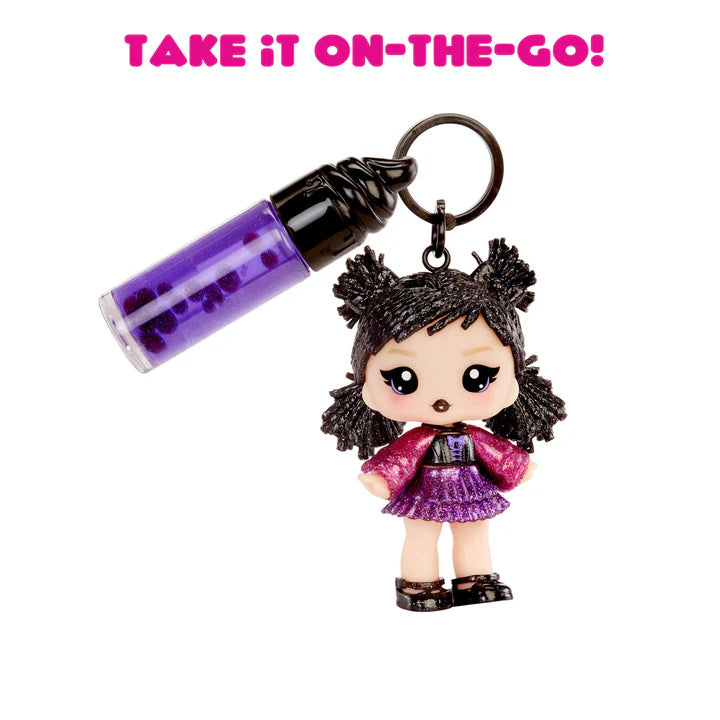 Keychain with a character holding a purple cylindrical object on a white background with text 'TAKE IT ON-THE-GO!'.