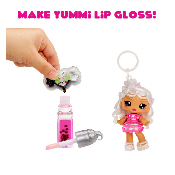 Make Yummi lip gloss set with a small doll and lip gloss bottle on a white background