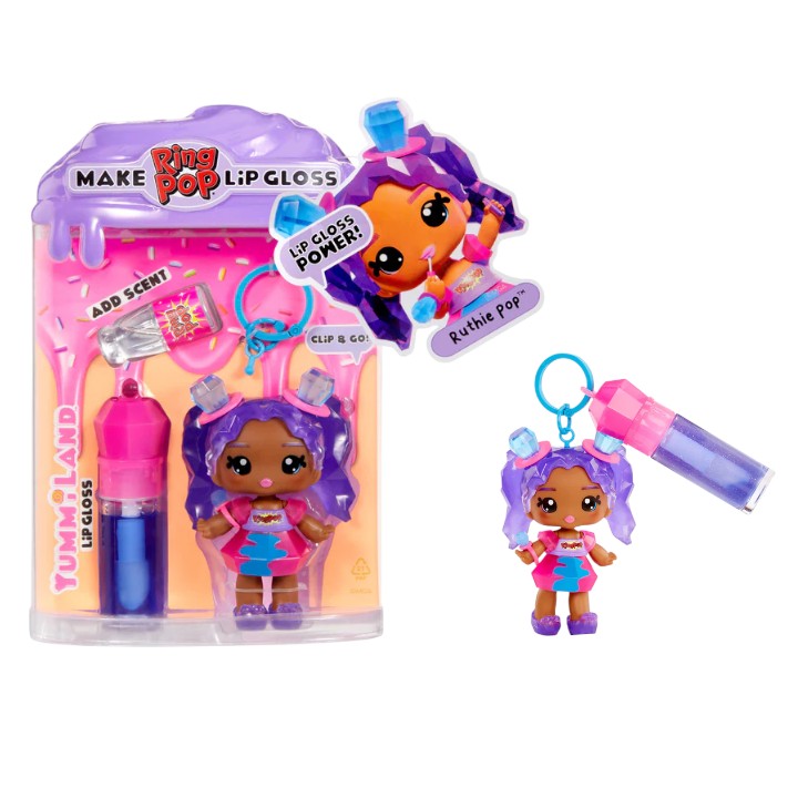 Yummiland x Ring Pop lip gloss doll with purple hair featuring gemstone accents, wearing a pink dress, shown with DIY lip gloss kit components including blue lip gloss tube, scented liquid packet, stirring spoon, and keychain ring.