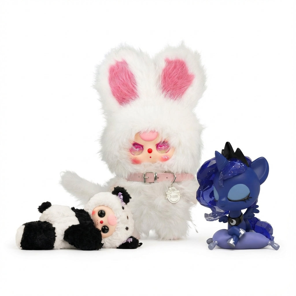 Designer Collectibles collection card featuring a white fluffy Kimmon rabbit, Baby Three Panda plush, and Mighty Jaxx Princess Luna vinyl figure against a clean white studio background.
