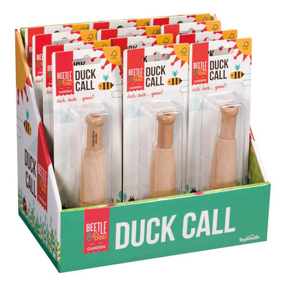 Display of Beetle & Bee Garden Duck Call packaging with a wooden duck call inside.