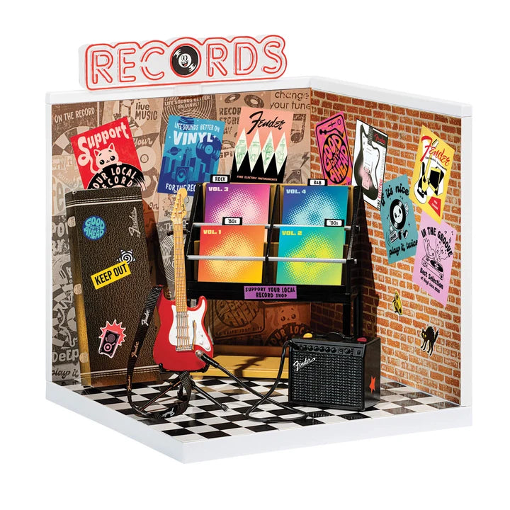 MGA's Miniverse Make It Mini Real Music Record Shop playset with miniature Fender guitar, amplifier, and record display shelf.