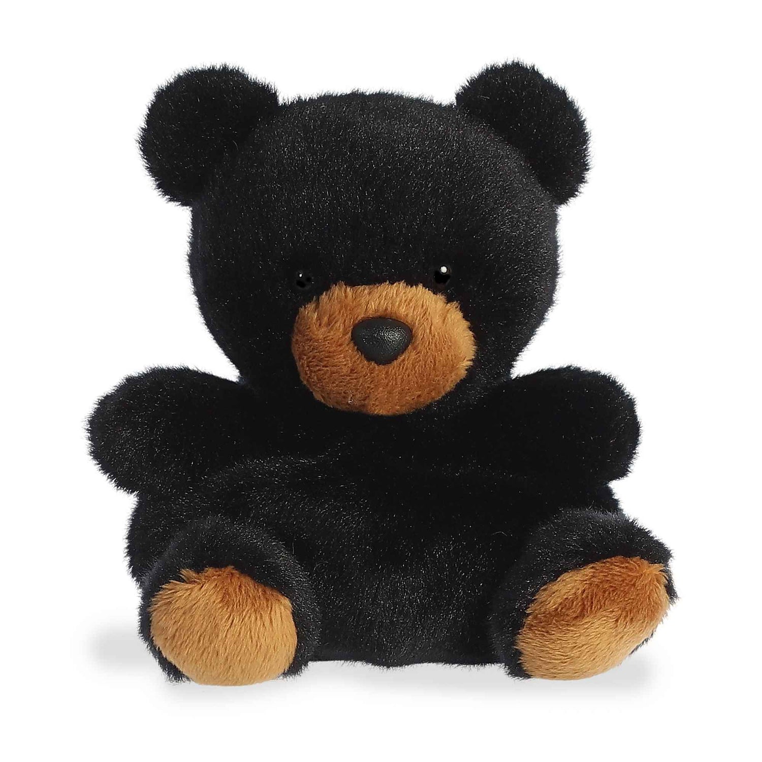 A product photo of the Palm Pals Sleepy Bear, a small black teddy bear plush with a brown snout, sitting on a white background.