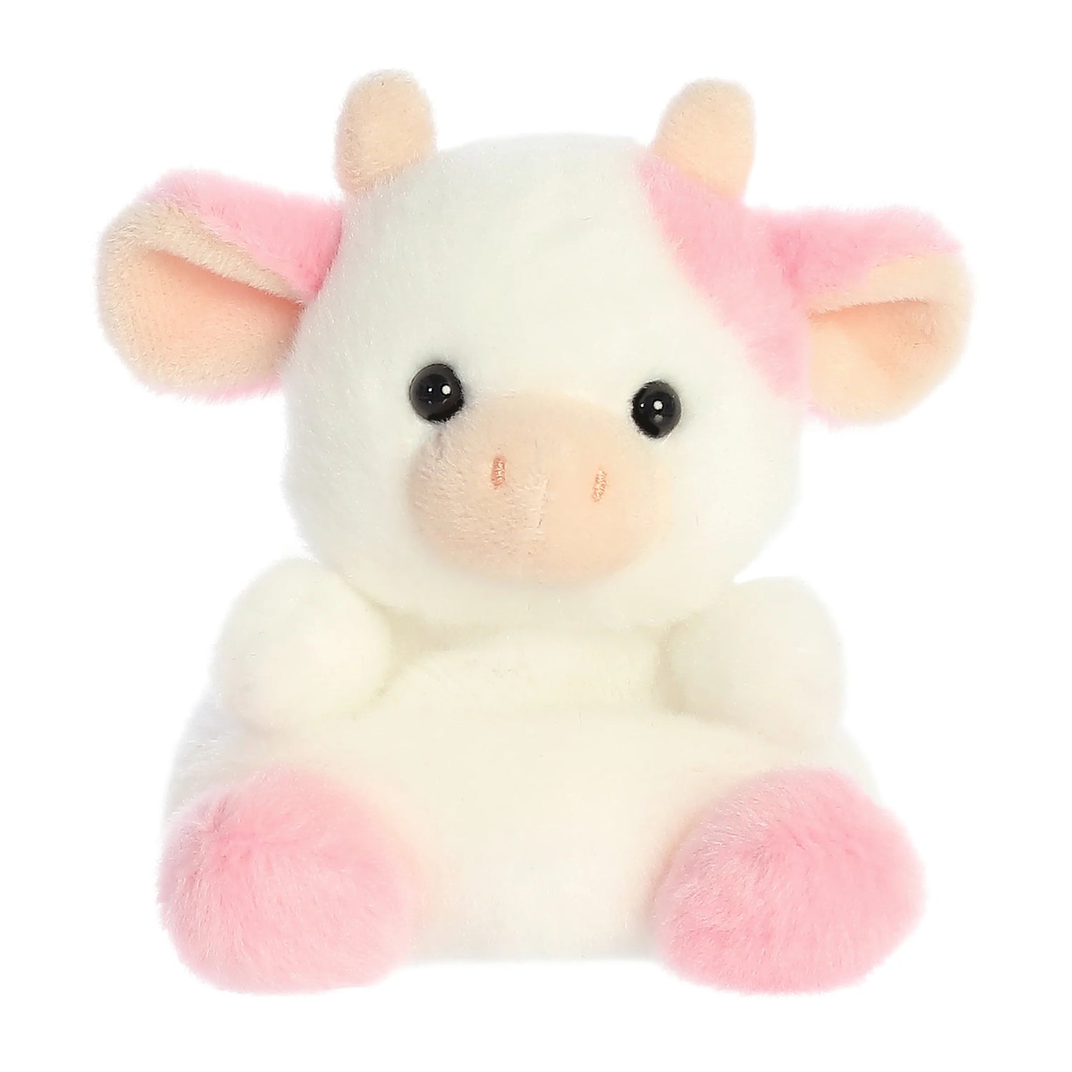 A product photo of the Palm Pals Belle Strawberry Cow 5-Inch Plush, a white cow stuffed animal with pink spots, ears, and hooves, sitting on a white background.
