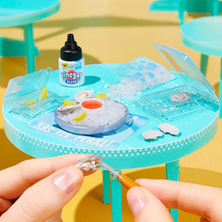 MGA's Miniverse Make It Mini Food Cafe Series 6 surprise capsule and crafted miniature coconut sorbet with raspberry syrup.