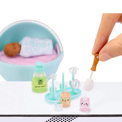 MGA's Miniverse Make It Mini Real Baby Series 1 surprise capsule with miniature baby doll, high chair, and crafted baby food.