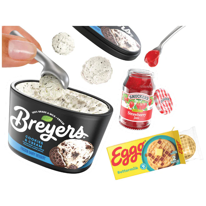 Breyers cookies & cream ice cream container with a spoon, Smucker's strawberry jelly jar, and Eggo waffles packaging on a white background.