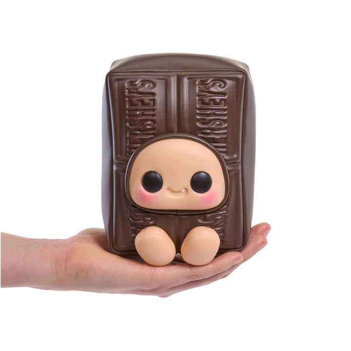 yojo Hershey's Series blind box collectible plush featuring cute expressive faces inside brown chocolate, white chocolate, and pink strawberry chocolate bar wrapper designs.