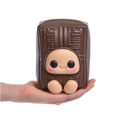 yojo Hershey's Series blind box collectible plush featuring cute expressive faces inside brown chocolate, white chocolate, and pink strawberry chocolate bar wrapper designs.