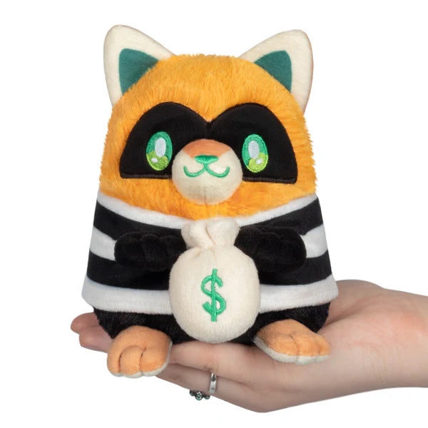Squishable Alter Egos Series 18 Cat Burglar Kitty 5.5-Inch Plush, an orange cat soft toy in a striped burglar outfit holding a money bag