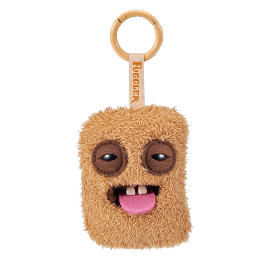 Seven variations of Fuggler Fugg Nuggets plush keyrings featuring funny-ugly monster faces with human-like teeth on fuzzy chicken nugget shapes.