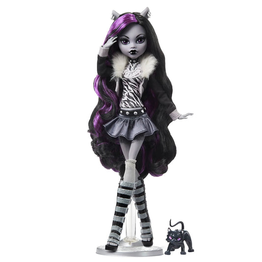 Monster High Clawdeen Wolf reel drama doll with long black hair, purple highlights, and a black and white outfit on a white background.