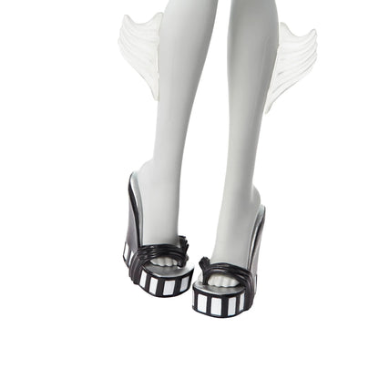 Black and white striped shoes with fish tail design on a white background