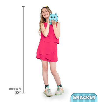 Girl holding a blue plush toy with a measurement indicator and 'Snacker' branding.