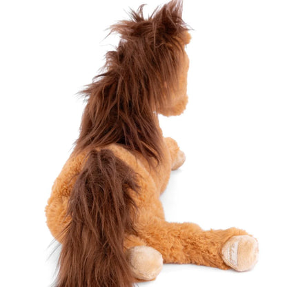 Bukowski Bears Tristan plush horse laying down, featuring a soft tan coat and long dark brown mane and tail.