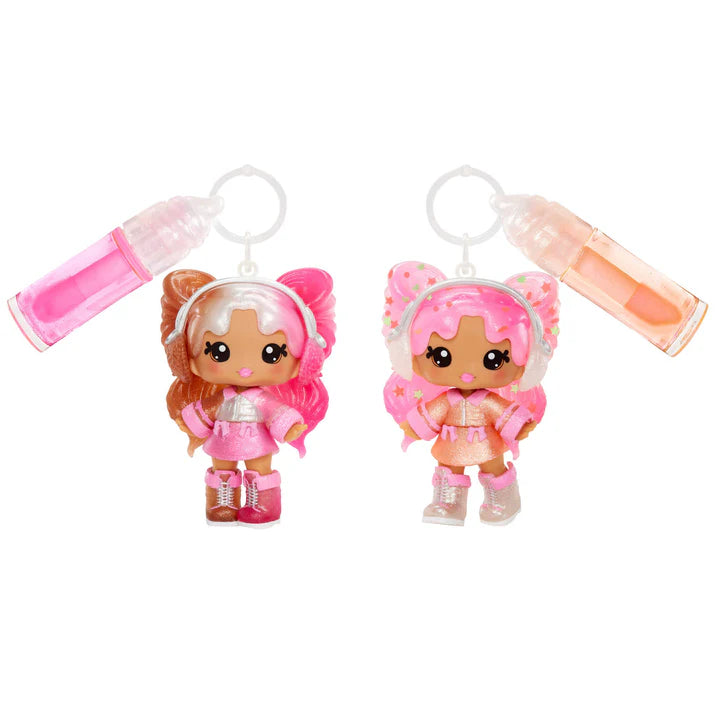 Two small figurines with pink hair and colorful outfits on a white background