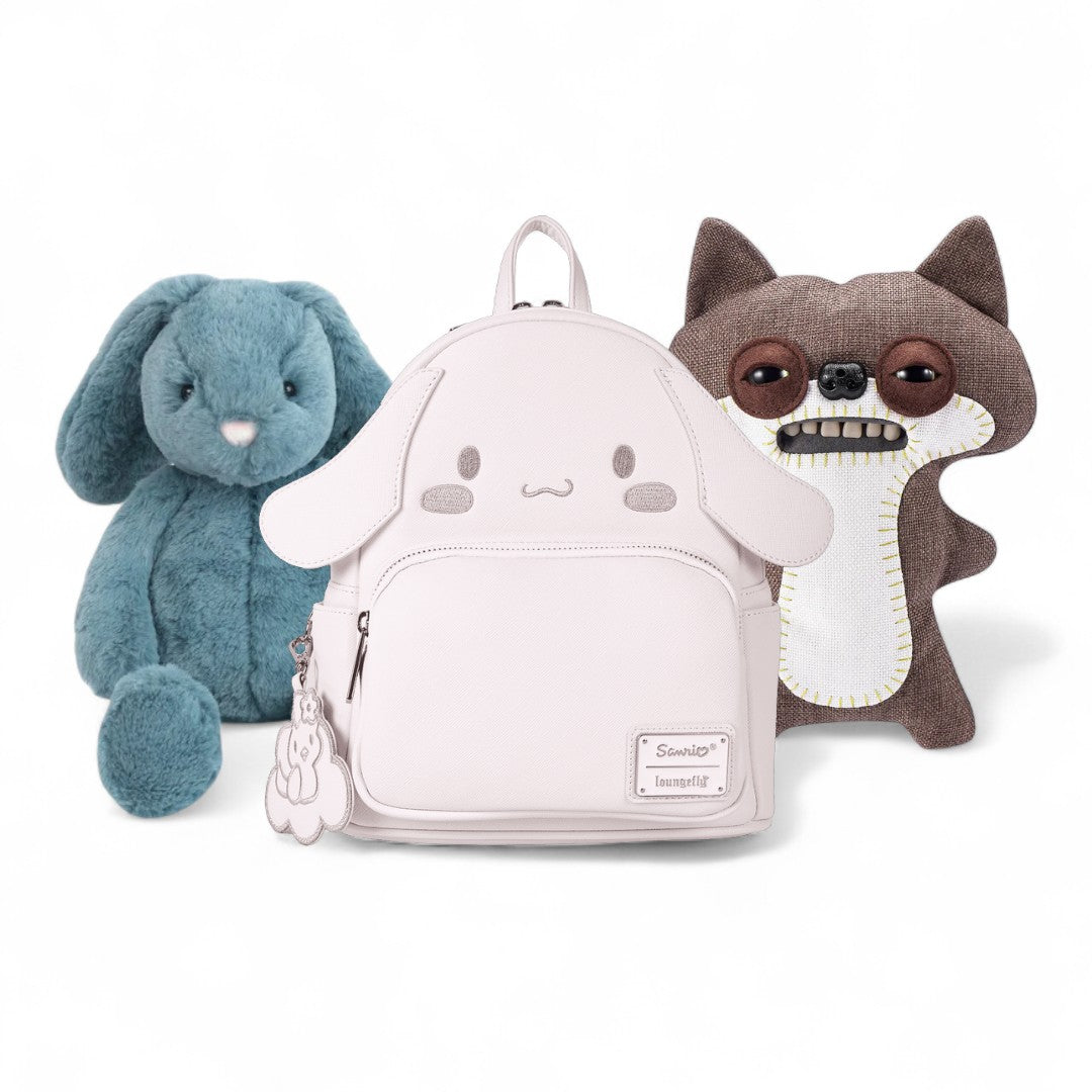 White backpack with cartoon face design, blue plush bunny, and brown plush dog on a white background