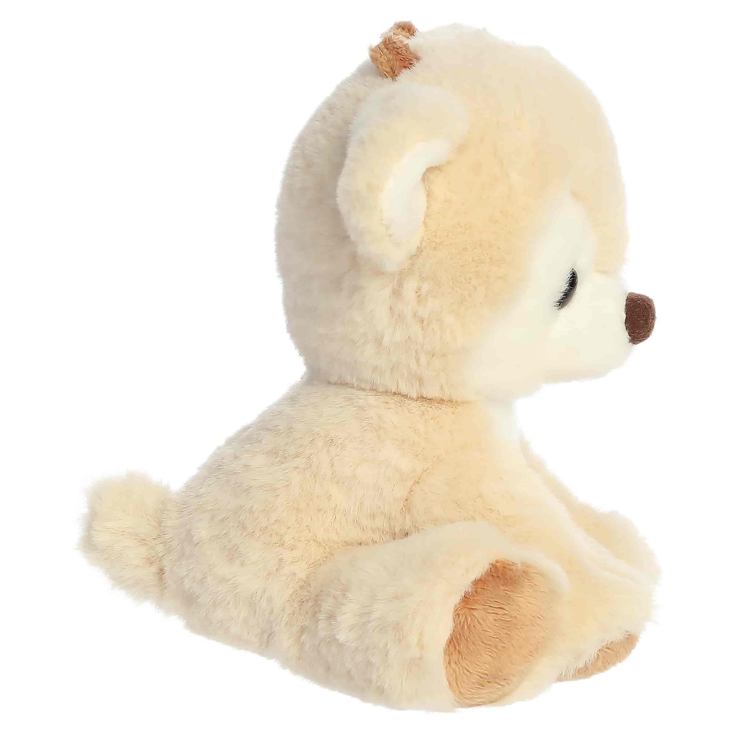 Aurora Dashing Reindeer plush in buttercream cream fur sitting upright with dark eyes, a brown nose, and brown hooves.