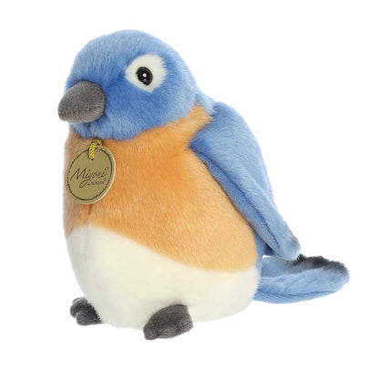 Aurora Miyoni Bluebird lifelike plush stuffed animal sitting with vibrant blue and orange plumage and soulful eyes.