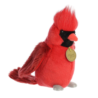 Aurora Miyoni Cardinal lifelike plush stuffed animal sitting with vivid red plumage, a black mask around its eyes, and grey feet.