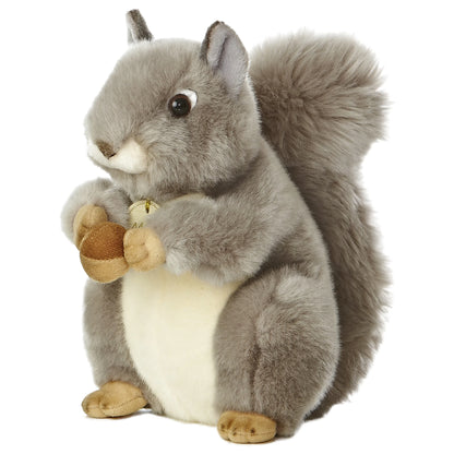 Aurora Miyoni Grey Squirrel lifelike plush stuffed animal sitting with an acorn, grey fur, and a bushy tail.