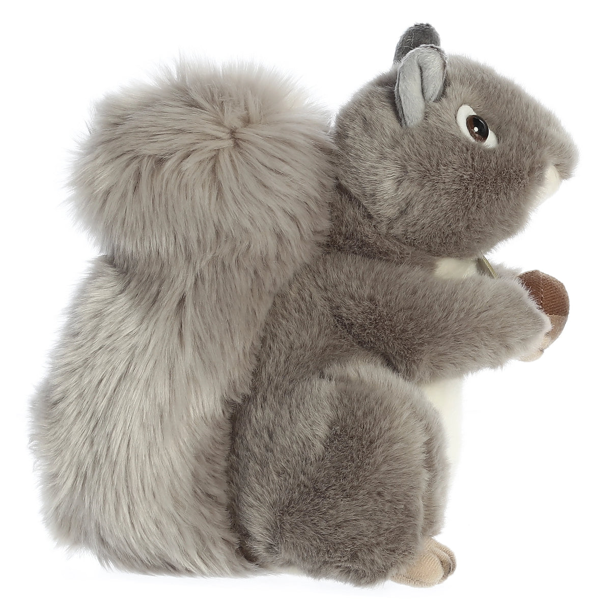 Aurora Miyoni Grey Squirrel lifelike plush stuffed animal sitting with an acorn, grey fur, and a bushy tail.