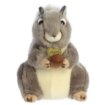 Aurora Miyoni Grey Squirrel lifelike plush stuffed animal sitting with an acorn, grey fur, and a bushy tail.