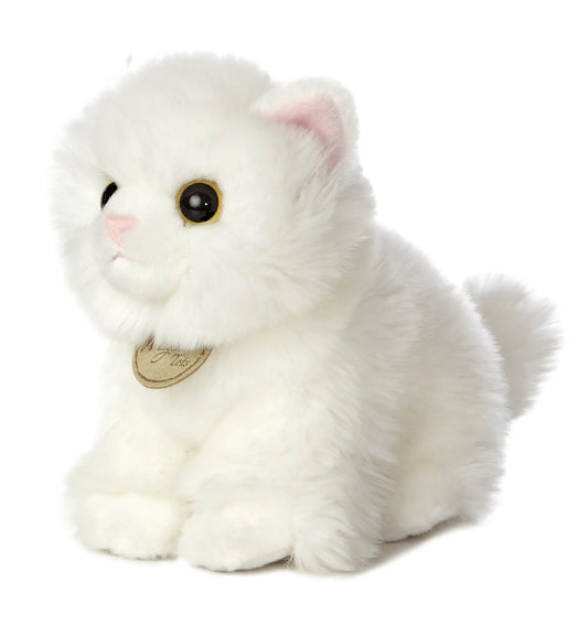 Aurora Miyoni Tots Angora Kitten plush animal featuring fluffy snowy white fur, expressive eyes, a sweet pink nose, and signature neck medallion sitting upright.