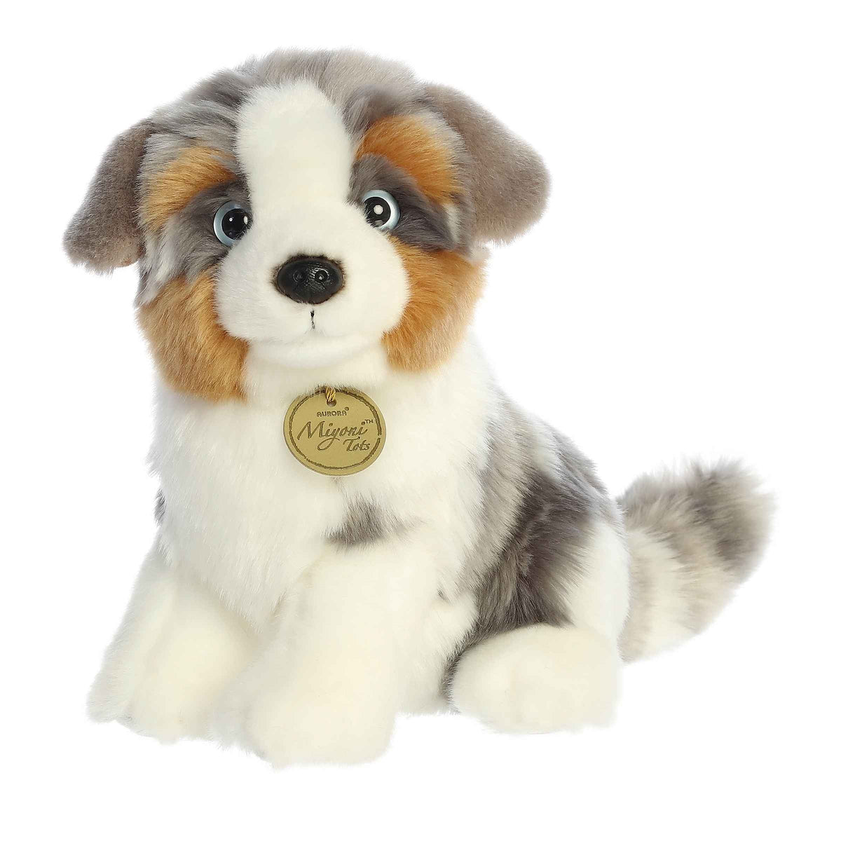 Aurora Miyoni Tots Australian Shepherd Pup lifelike baby plush stuffed animal sitting with a multi-colored black, white, and tan coat and expressive eyes.