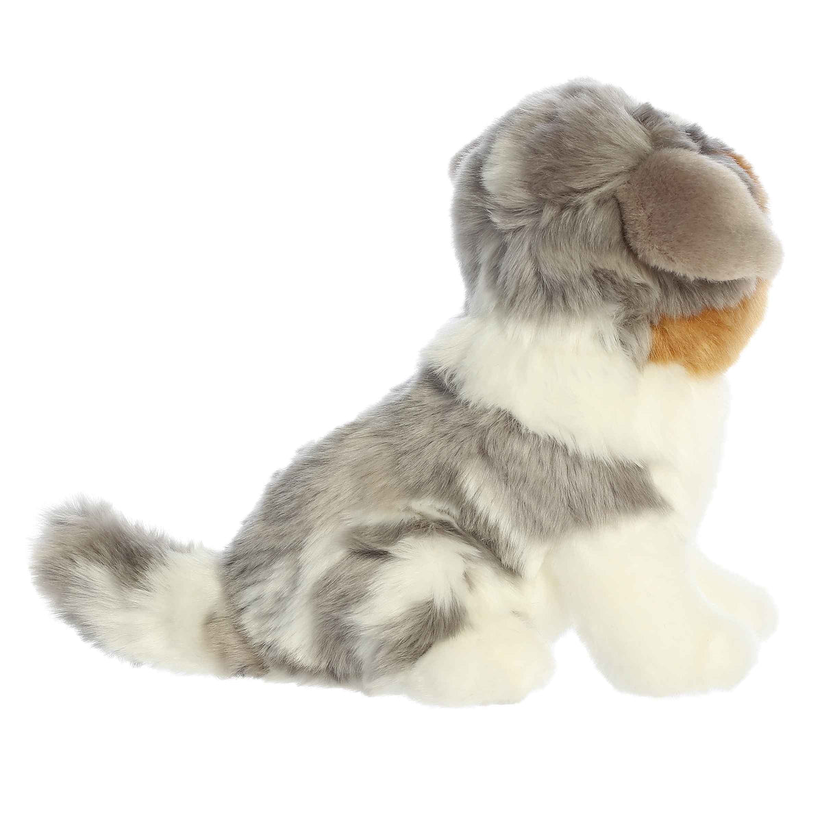 Aurora Miyoni Tots Australian Shepherd Pup lifelike baby plush stuffed animal sitting with a multi-colored black, white, and tan coat and expressive eyes.
