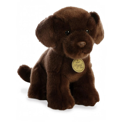 Aurora Miyoni Tots Chocolate Lab Pup lifelike baby plush stuffed animal sitting with soft chocolate-brown fur, floppy ears, and big expressive eyes.