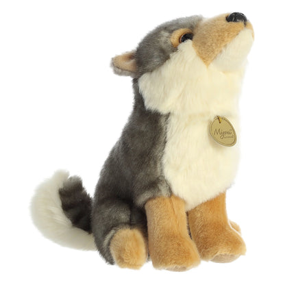 Aurora Miyoni Wolf lifelike plush stuffed animal sitting with gray and cream fur, amber eyes, and a fluffy tail.