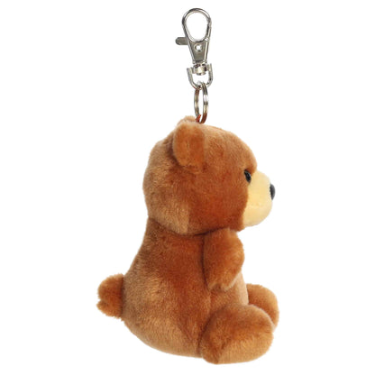 Aurora Palm Pals Artie Bear plush clip-on featuring soft chestnut-brown fur, a tan muzzle, dark eyes, and a silver swivel clasp.