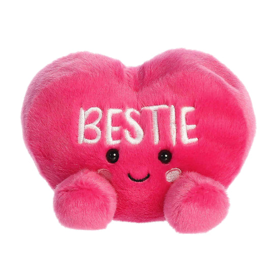 Product view of Aurora Palm Pals Bestie Candy Heart, a small hot pink plush heart with embroidered text.