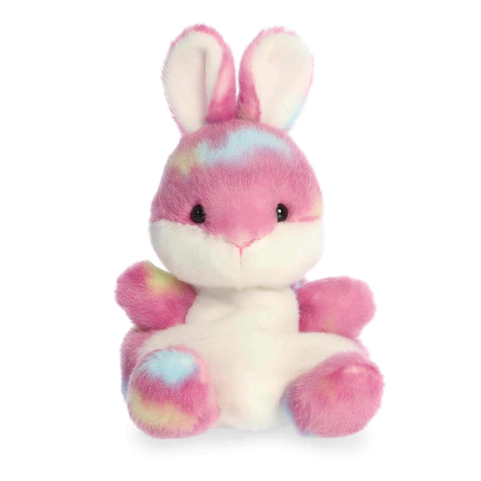 Product view of Aurora Palm Pals Buniberry Jellybean Bunny, a pink rabbit plush with tie-dye spots of blue and yellow and a white tummy.
