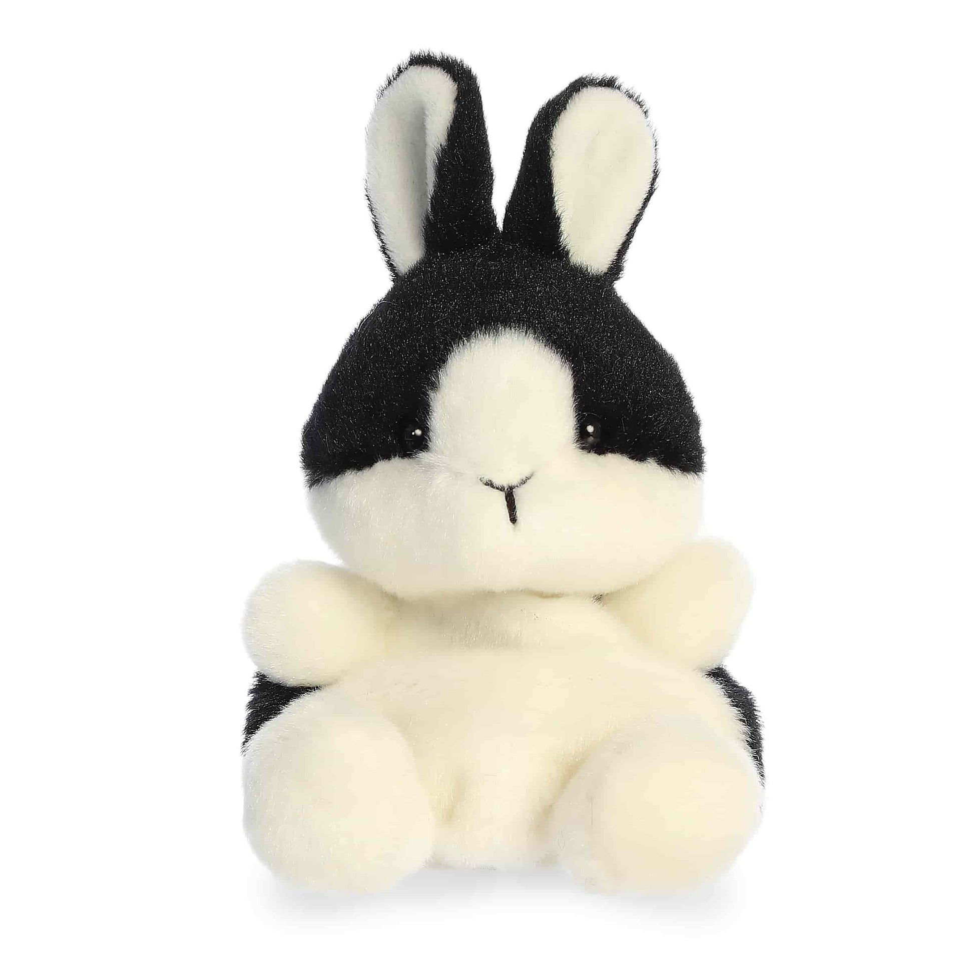 Product view of Aurora Palm Pals Jan Dutch Bunny, a black and white rabbit plush with a sitting pose.