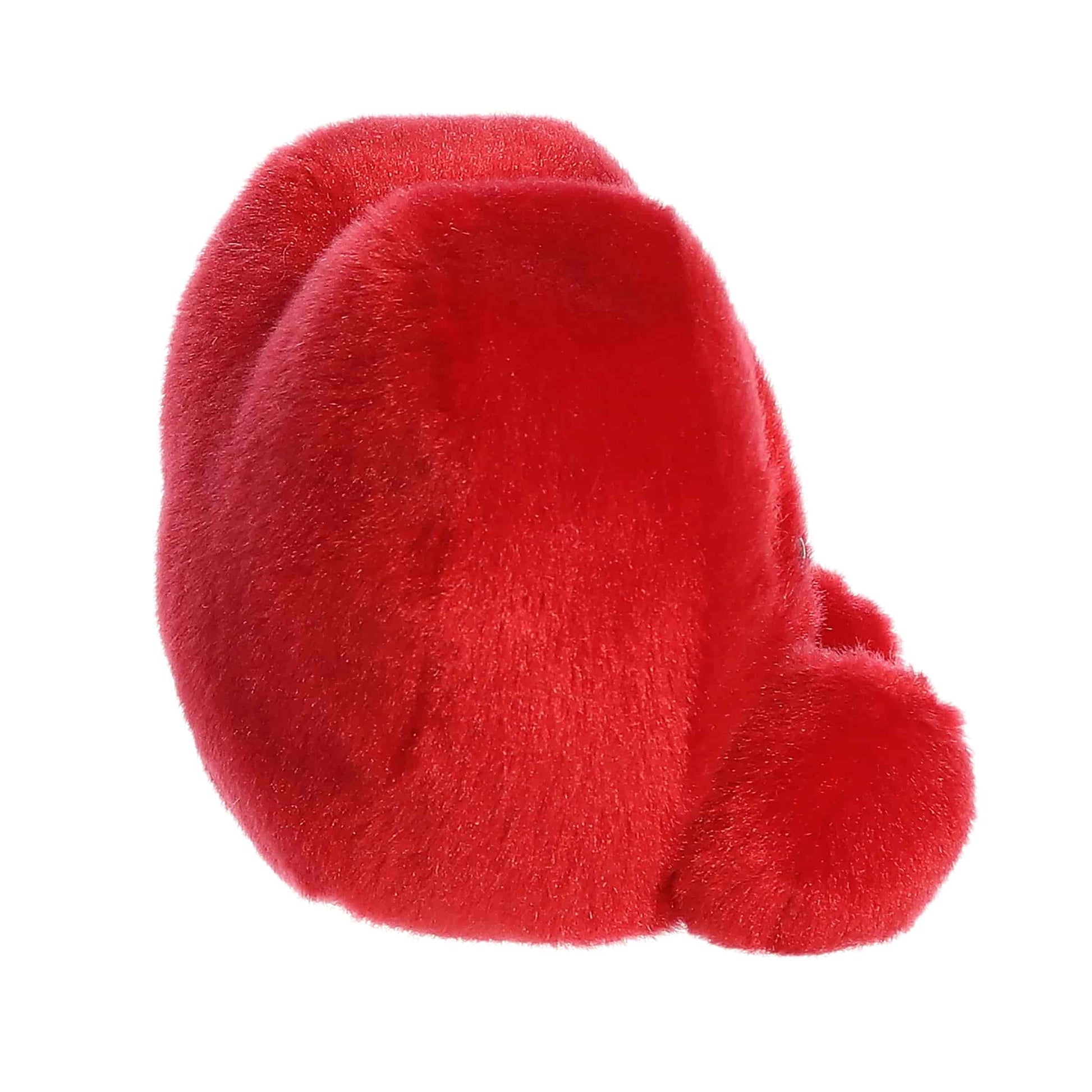 Side view of Aurora Palm Pals Kimi Kisses Heart, a small 5-inch red plush. 