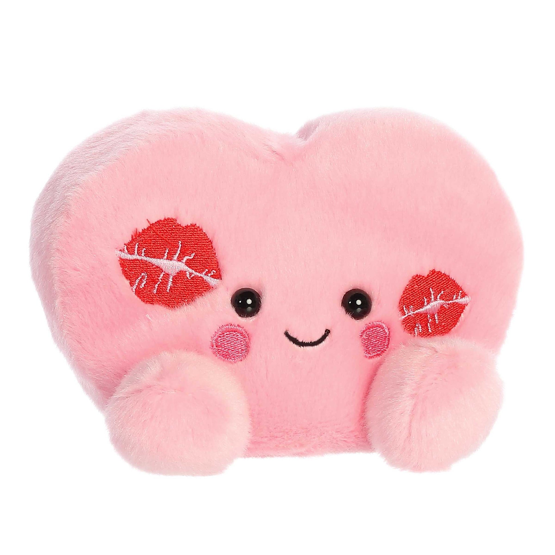 Angled view of Aurora Palm Pals Kinsley Kisses Heart plush