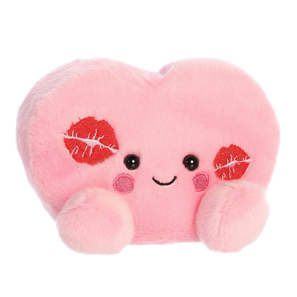 Angled view of Aurora Palm Pals Kinsley Kisses Heart plush