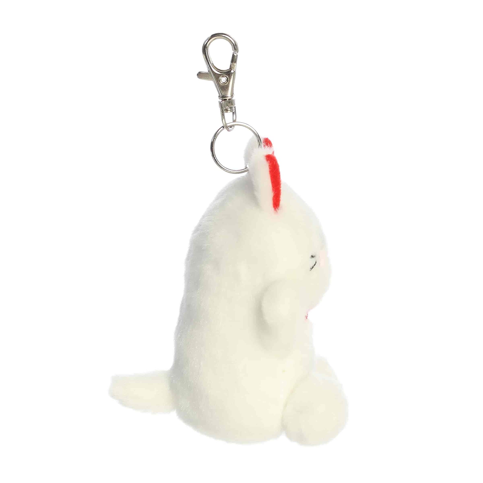 Aurora Palm Pals plush clip-on featuring Kota the Lucky Cat, a white kitty with red ears, pink cheeks, and a golden bell collar.