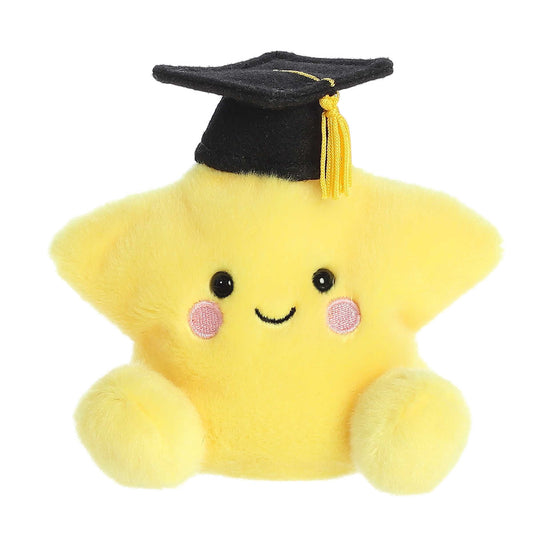Product view of Aurora Palm Pals Magna Grad Star, a yellow plush star wearing a black graduation cap with a gold tassel.