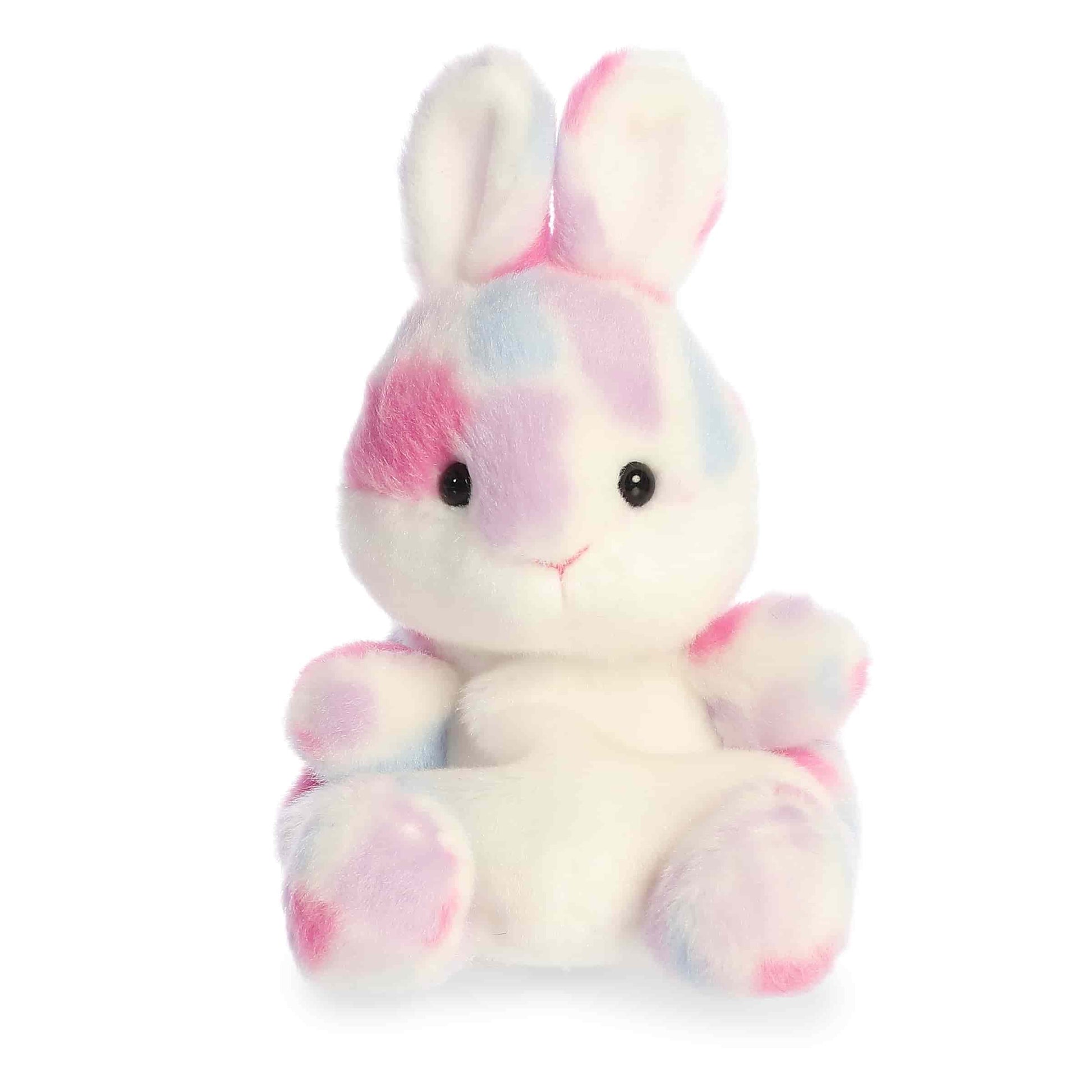 Product view of Aurora Palm Pals Marta Mosaic Bunny, a white rabbit plush with pastel pink and blue spots.