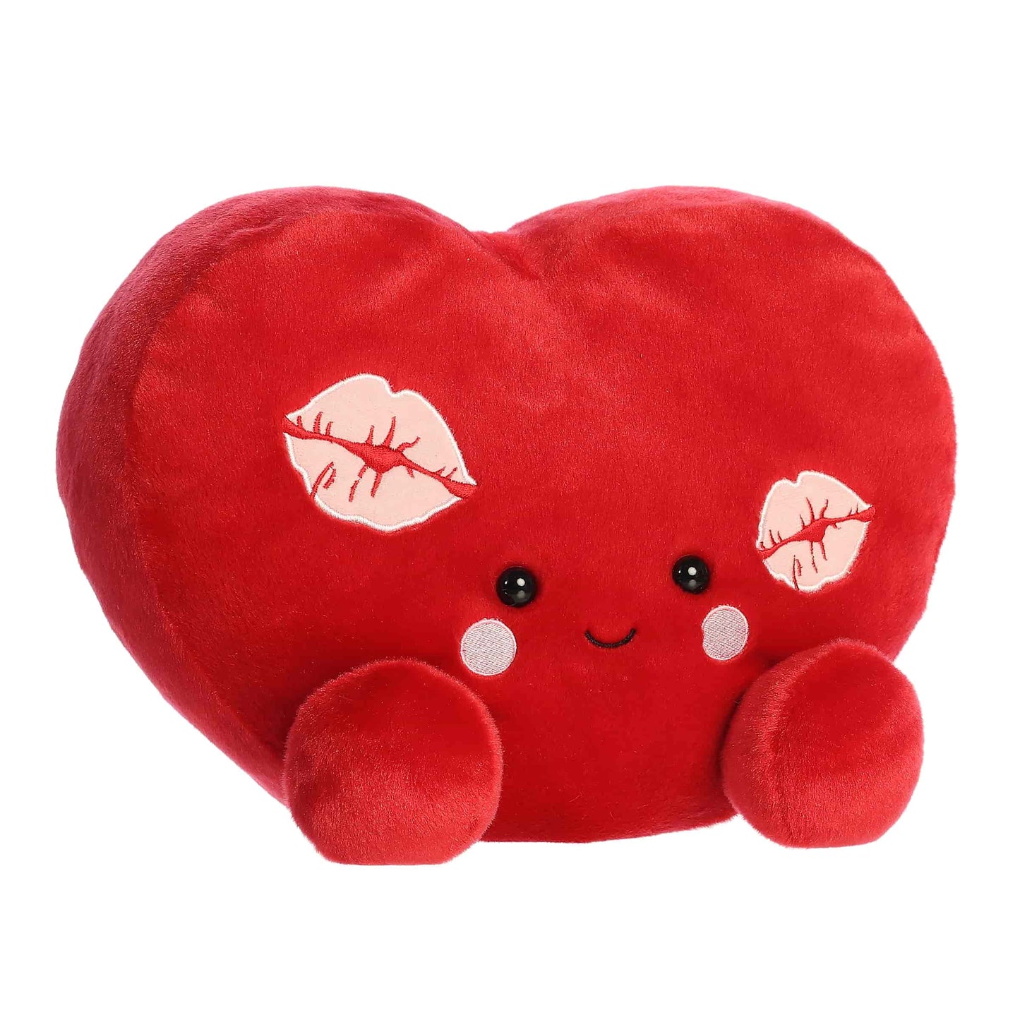 Angled  view of Aurora Party-Sized Palm Pals Kimi Kisses Heart, a large 13-inch red plush heart. 