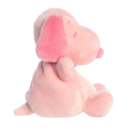 Side  view of Aurora Palm Pals Peanuts Snoopy Pink, a small beagle plush.