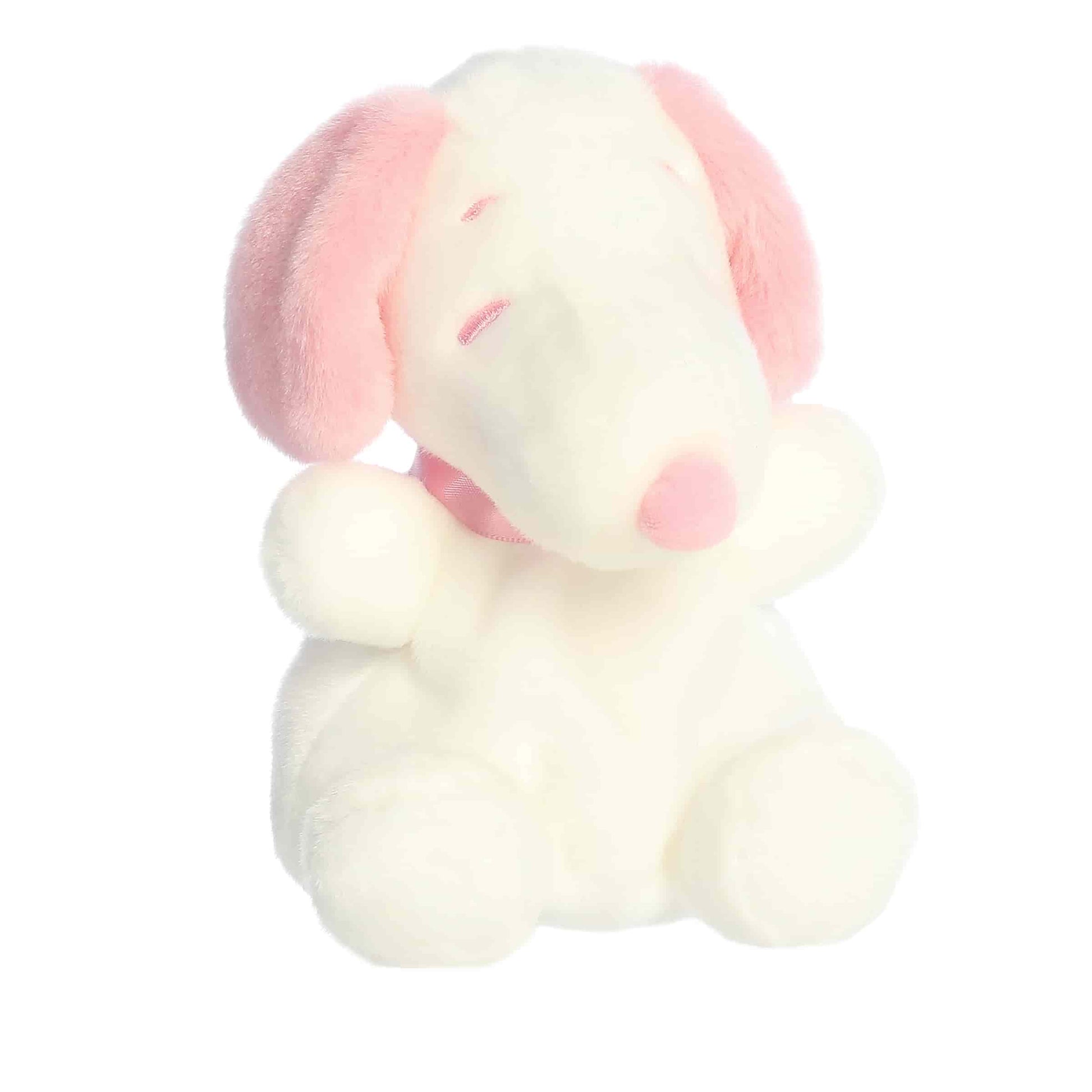 Product view of Aurora Palm Pals Peanuts Snoopy Pink & White Valentine's Day plush featuring pink ears, a pink nose, and a ribbon.