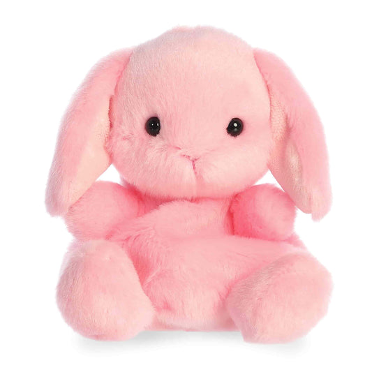 Product view of Aurora Palm Pals Petal Pink Lop Bunny, a soft pink rabbit plush with long floppy ears and a sitting pose.