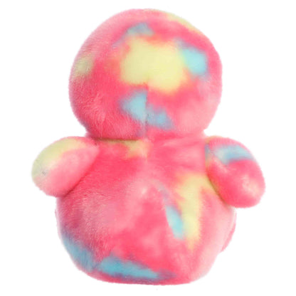 Aurora Palm Pals Shimmer Rubber Ducky plush animal featuring bright pink tie-dye fur with pastel spots, an orange bill, and dark eyes sitting upright.