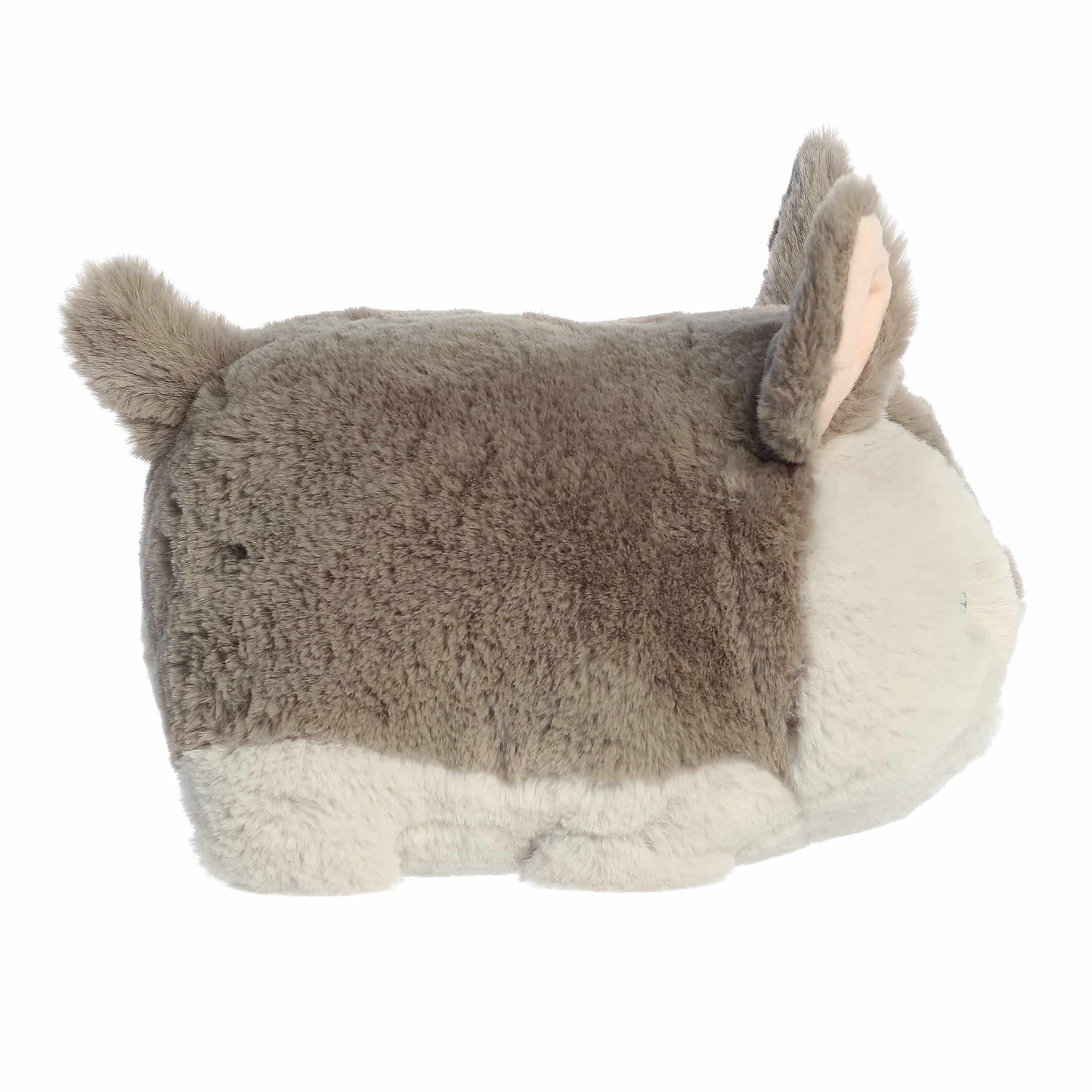 Side view of A product photo of the 10-inch Aurora Spudsters Arnie Armadillo, a grey and white, potato-shaped plush armadillo with a pink nose.